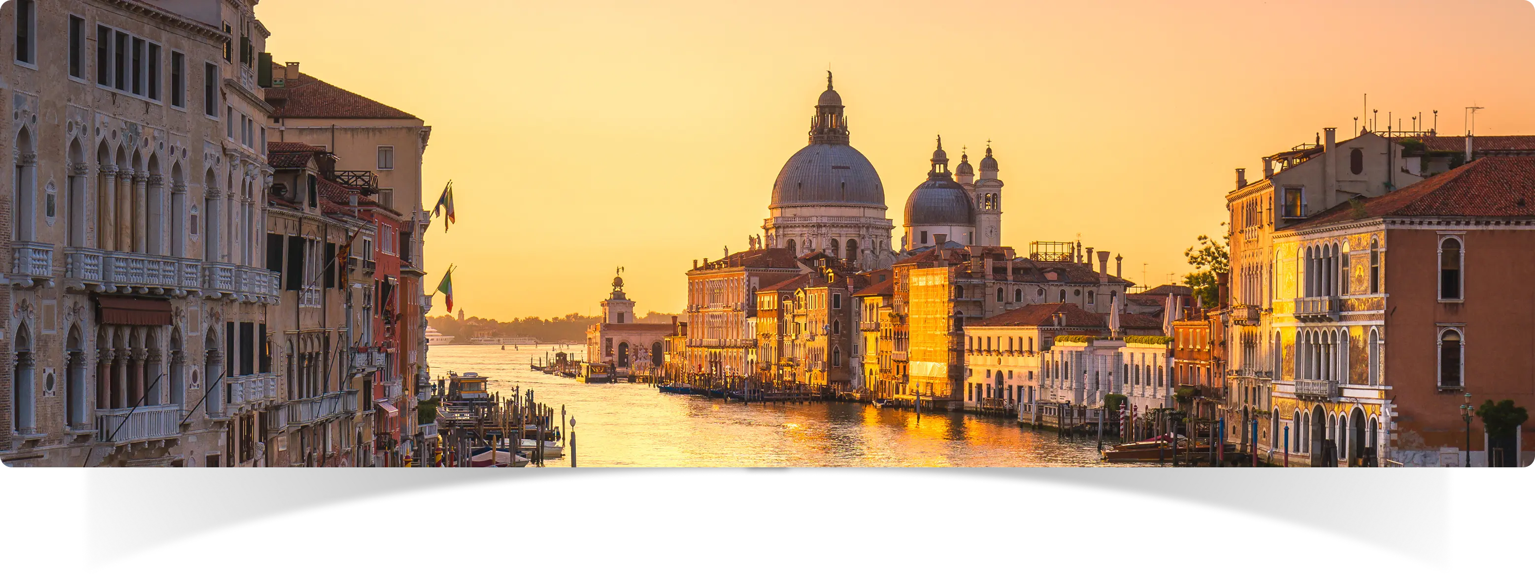 Venice canal and historic buildings at golden hour